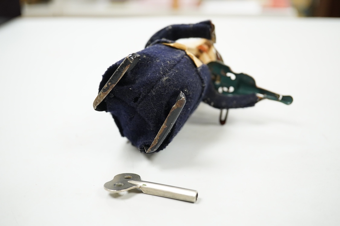 A Schuco felt clockwork pig violinist and key, 13cm high